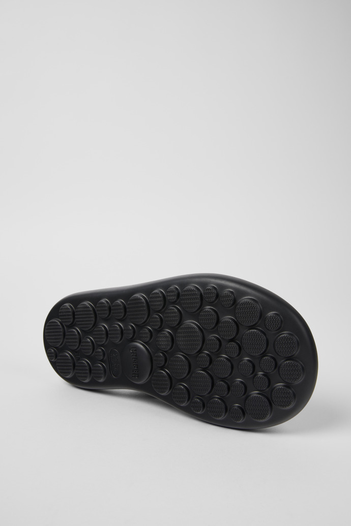 The soles of Pelotas Flota Black Leather Flip-Flop for Women