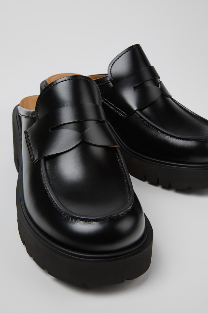 Close-up view of Milah Black Leather Clogs for Women