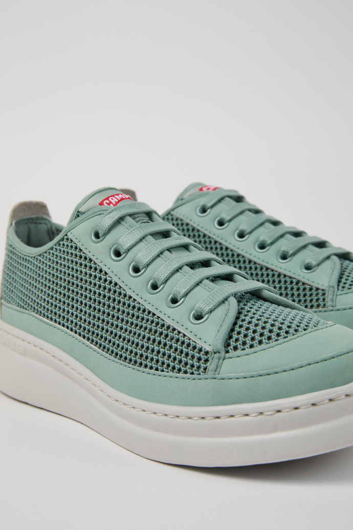 Close-up view of Runner Green TENCEL® Lyocell and Leather Women's Sneakers.