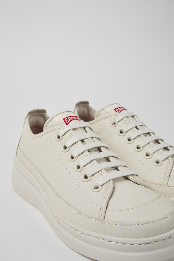 Close-up view of Runner Up White Leather Women's Sneakers.