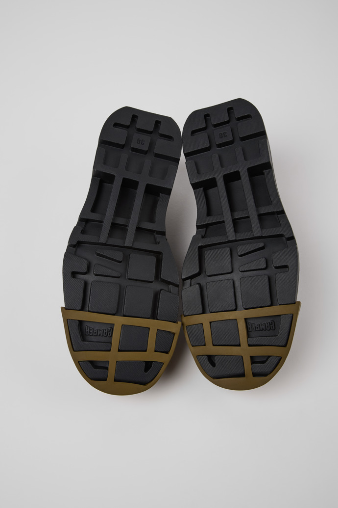 The soles of Junction Black Leather Moccasins for Women.