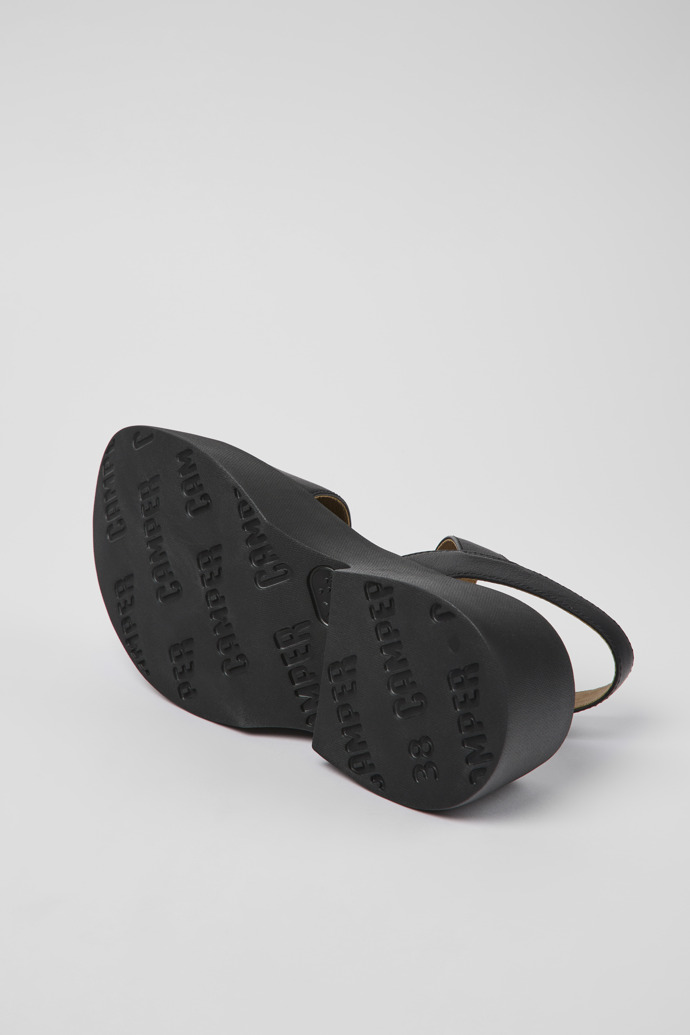 The soles of Tasha Black Leather Sandal for Women