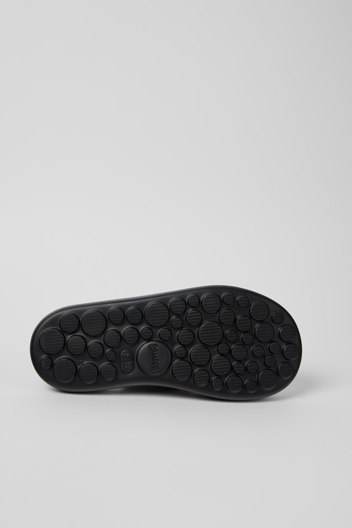 The soles of Pelotas Flota Black Leather Cross-strap Sandal for Women