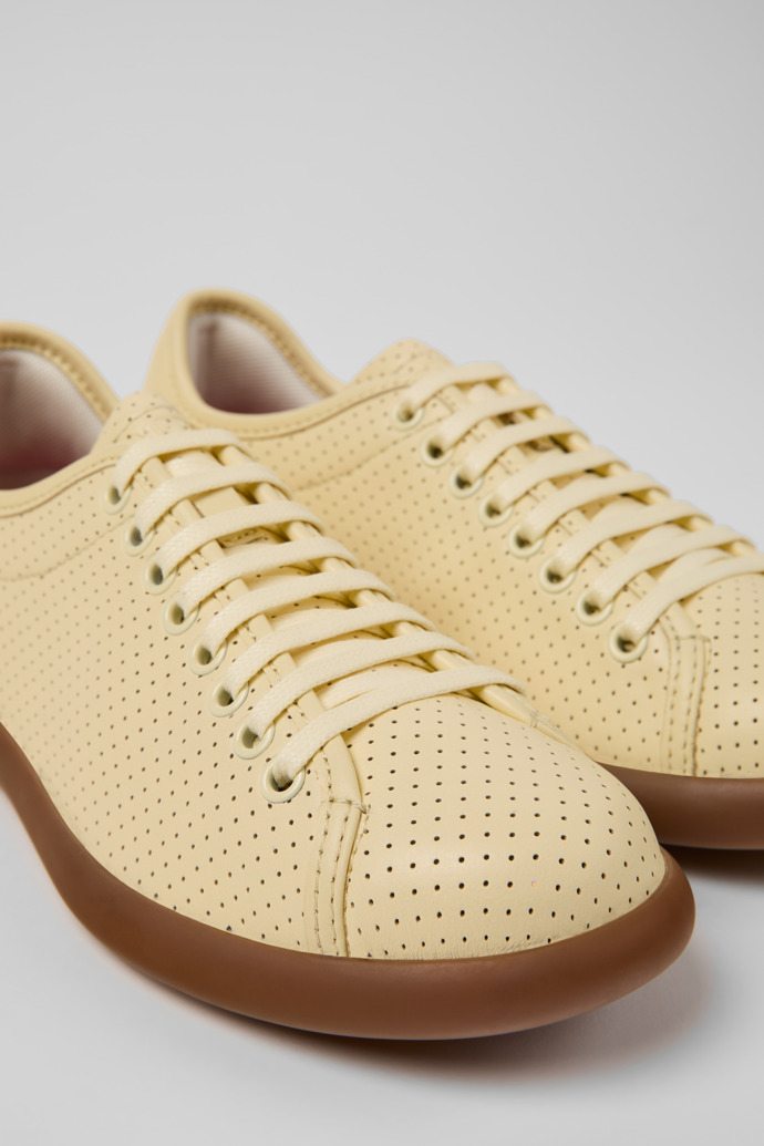 Close-up view of Pelotas Soller Yellow Leather Sneakers for Women.