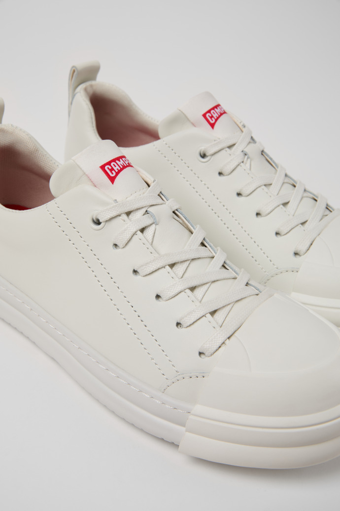 Close-up view of Junction Runner White Leather Sneakers for Women.
