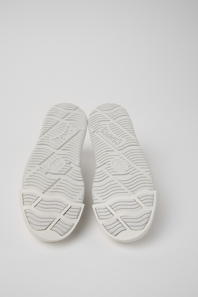The soles of Junction Runner White Leather Sneakers for Women.