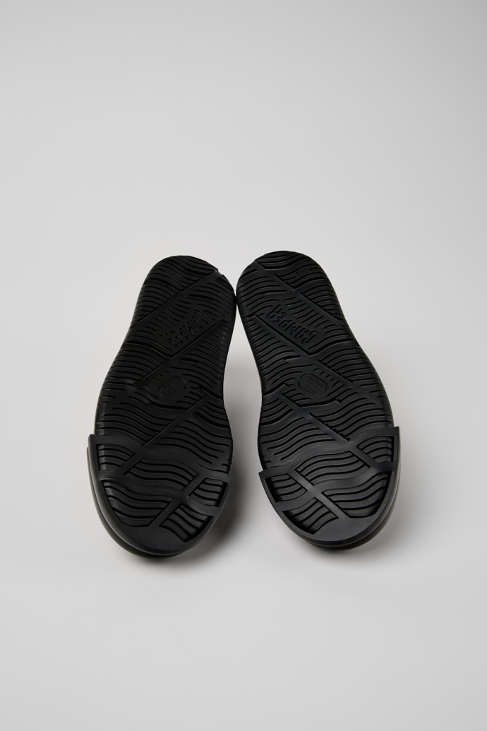 The soles of Junction Runner Black Leather Sneakers for Women.