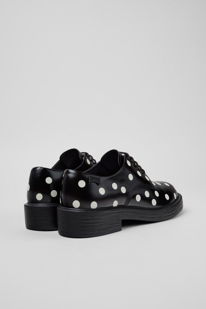 Back view of Dean Black and White Leather Shoes for Women.