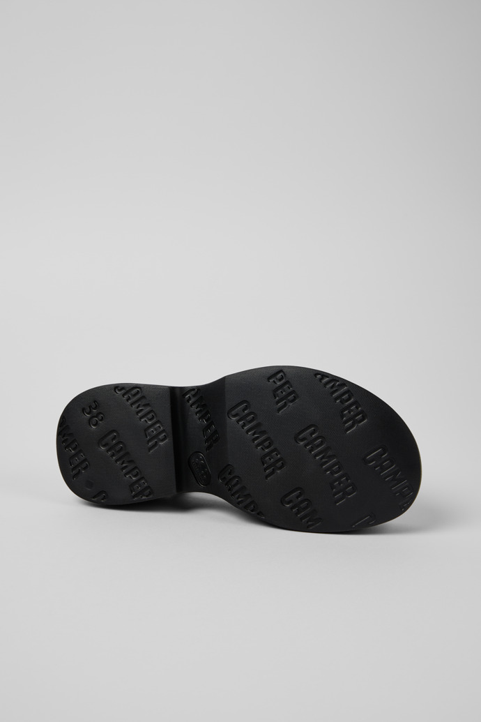 The soles of Tasha Black Leather Sandals for Women.