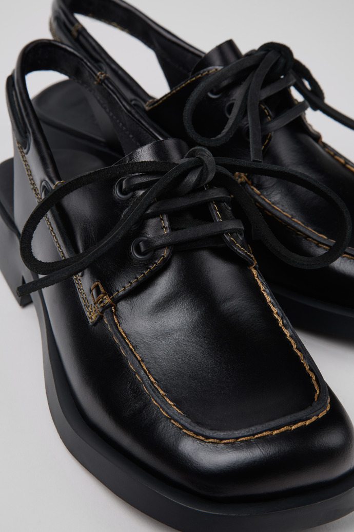 Close-up view of Donna Black Leather Semi-Open Shoes for Women.