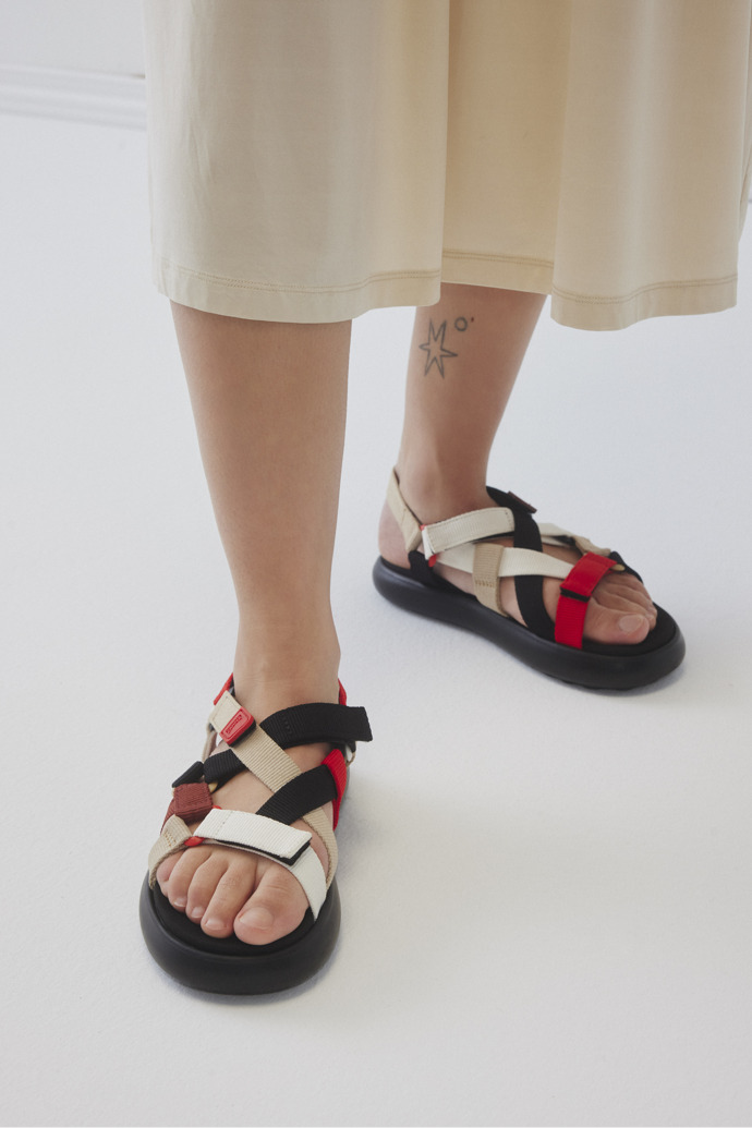 A model wearing Twins Multicolor Recycled PET Sandals for Women.