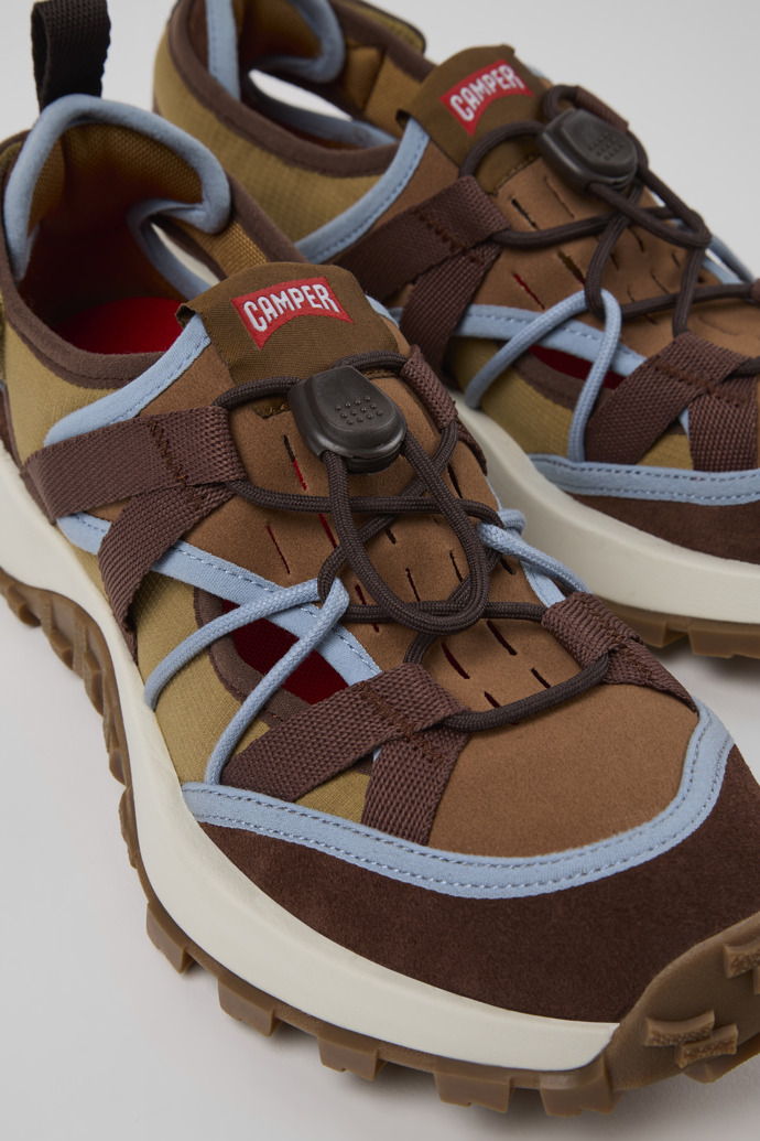 Close-up view of Drift Trail Brown Textile and Nubuck Leather Sneakers for Women.