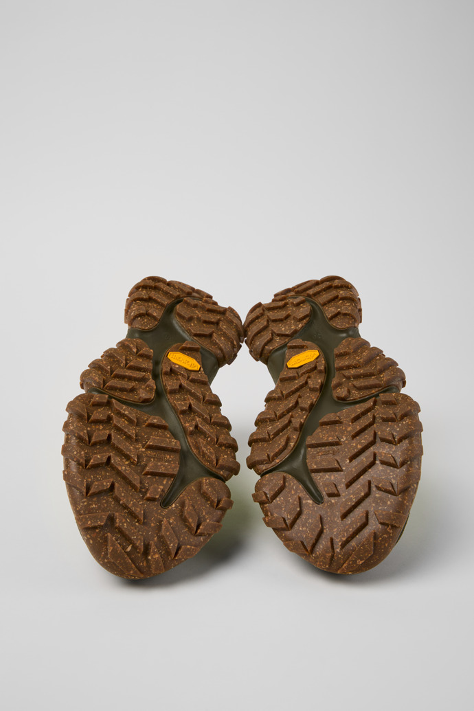 The soles of Karst Trek - GORE-TEX Green and Brown Textile and Nubuck Sneakers for Women.