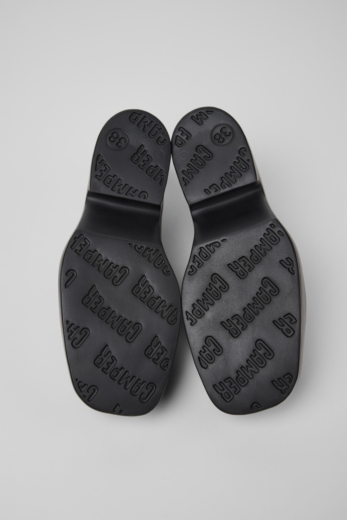The soles of Billie Black Leather Moccasins for Women.