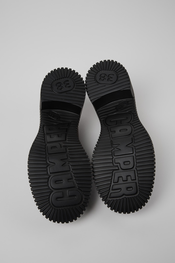 The soles of Pix London Burgundy Leather Moccasins for Men.