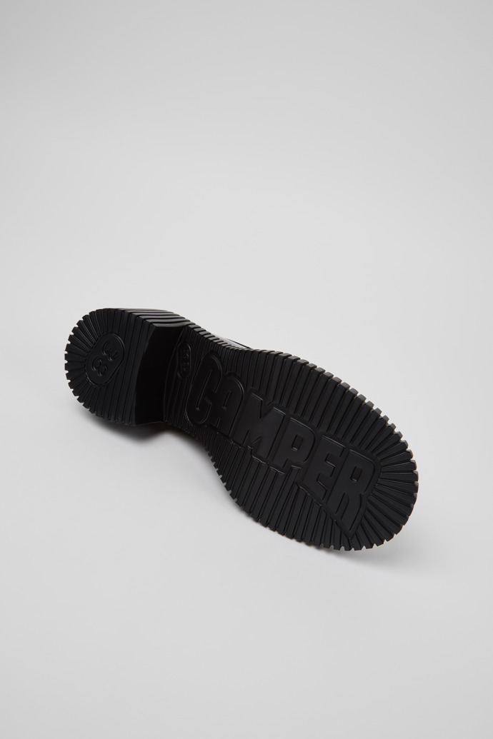 The soles of Twins Black Leather Moccasins for Women.