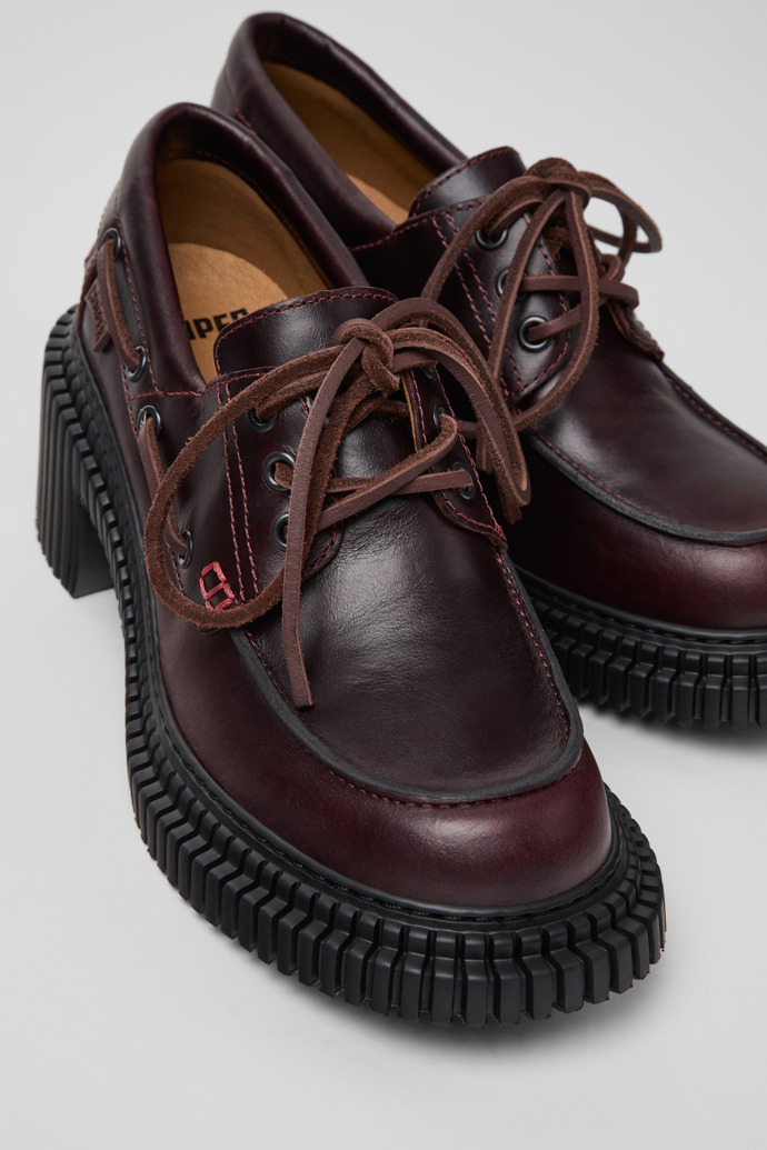 Close-up view of Pix London Burgundy Leather Moccasin Shoes for Women.