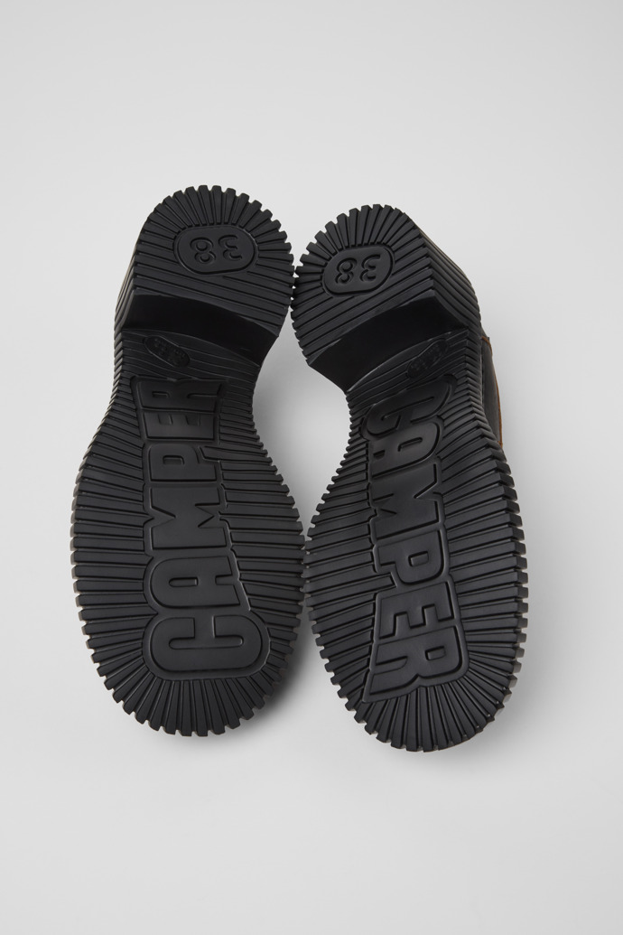 The soles of Pix London Burgundy Leather Moccasin Shoes for Women.