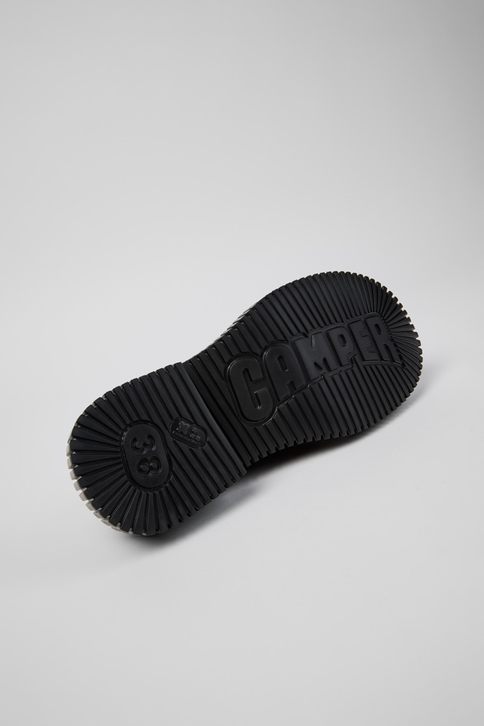 The soles of Pix Berlin Black Leather Shoes for Women.