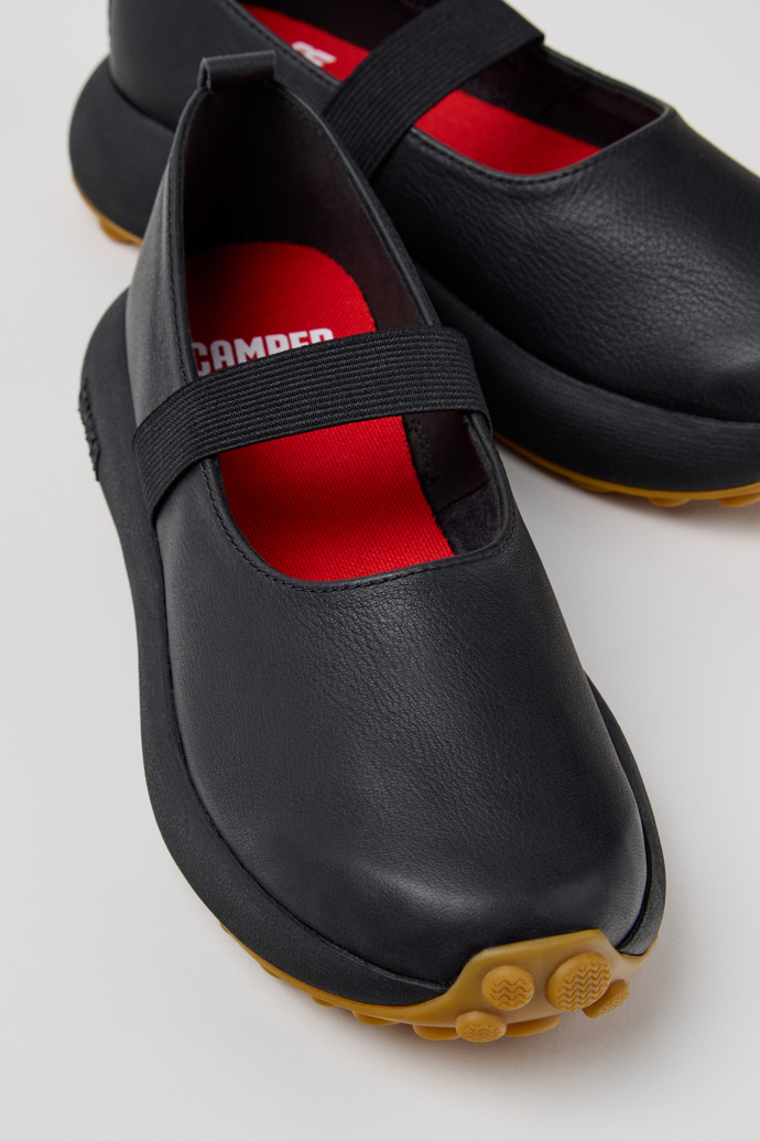 Close-up view of Pelotas Athens Black Leather Sneakers for Women.