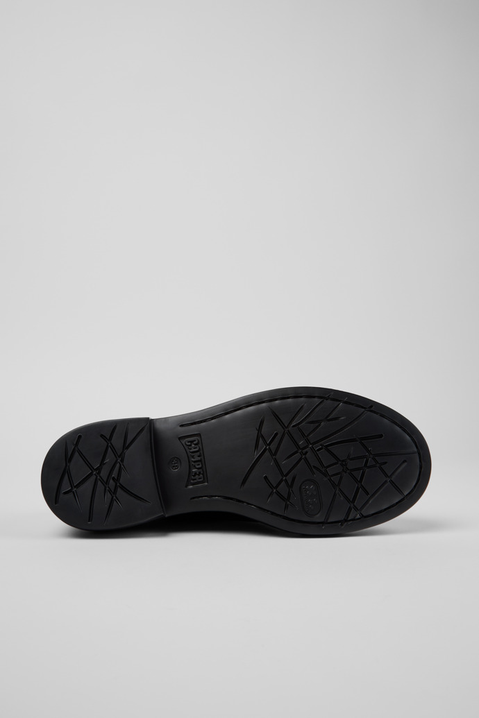 The soles of Twins Black Leather Shoes for Women.