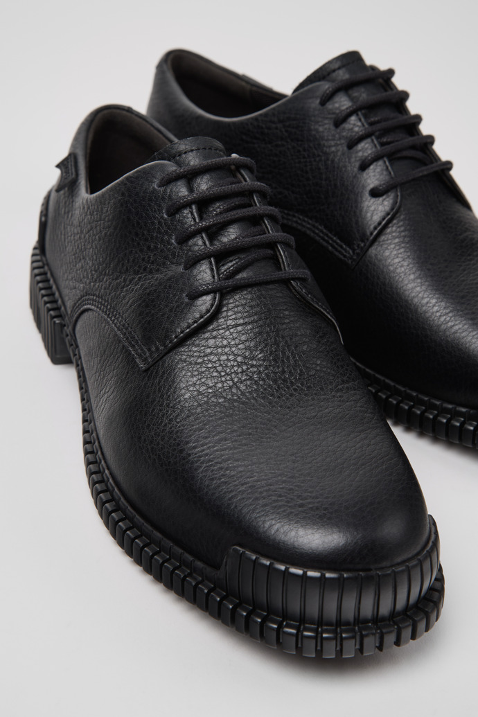 Close-up view of Pix Black Leather Shoes for Women.