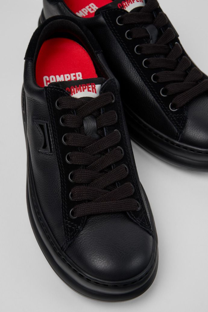 Close-up view of Runner Black Leather and Nubuck Sneakers for Women.