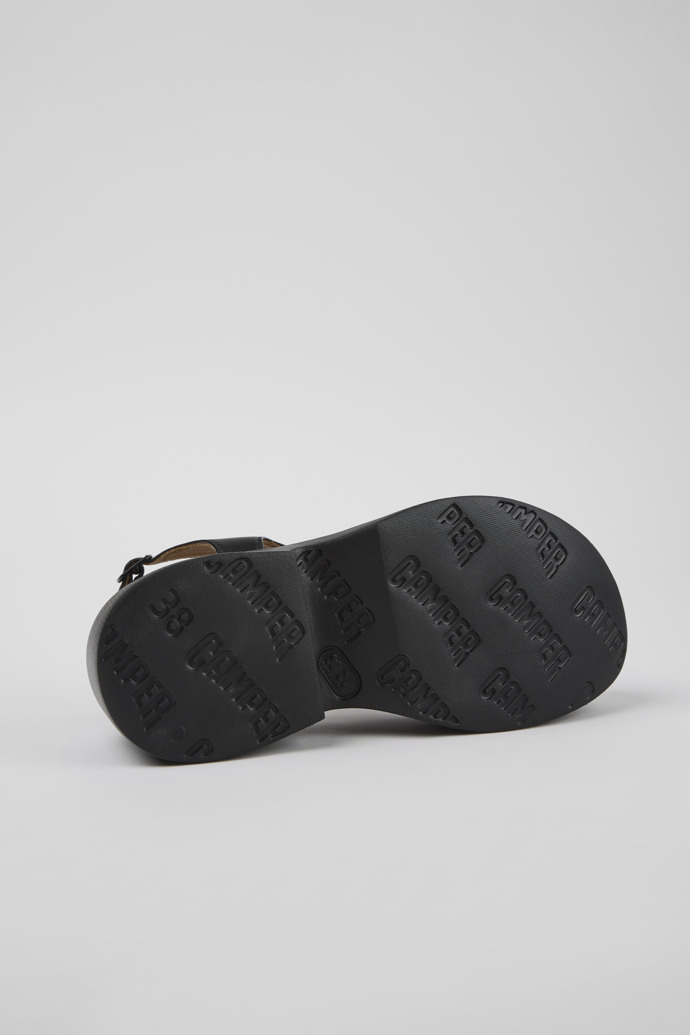 The soles of Tasha Black Leather Sandals for Women.
