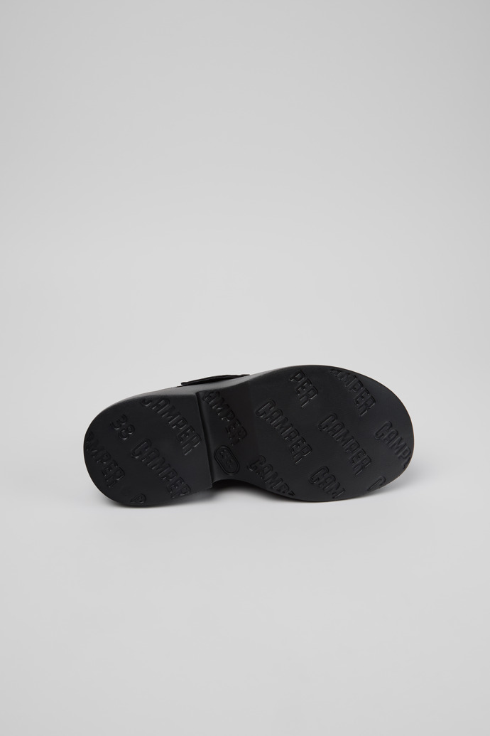 The soles of Tasha Black Leather Sandals for Women.