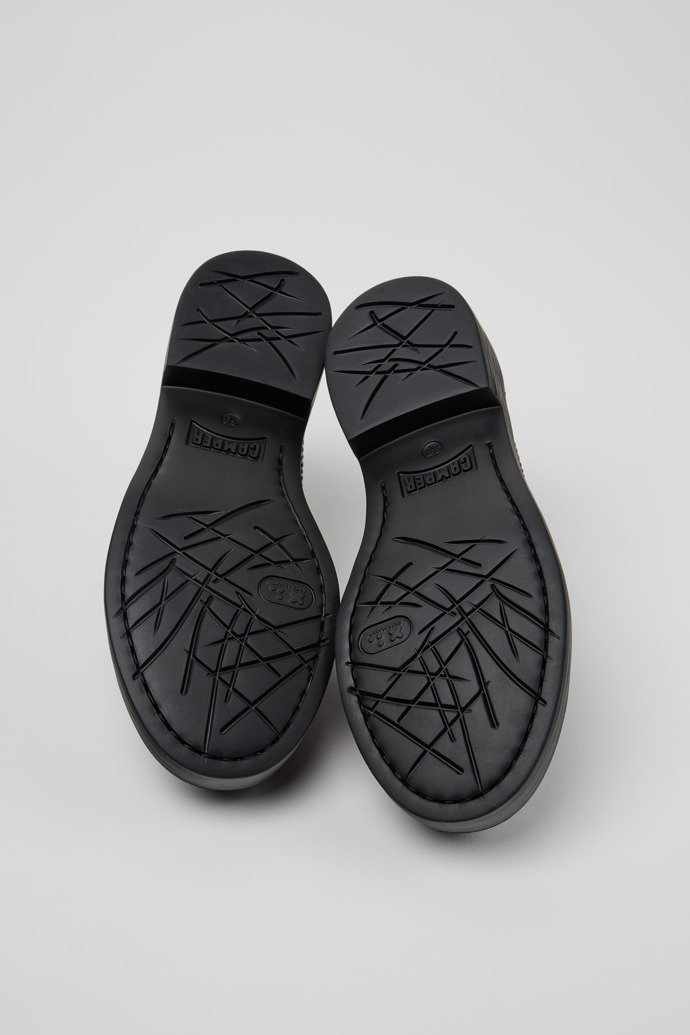 The soles of Twins Black Leather Moccasins for Women.