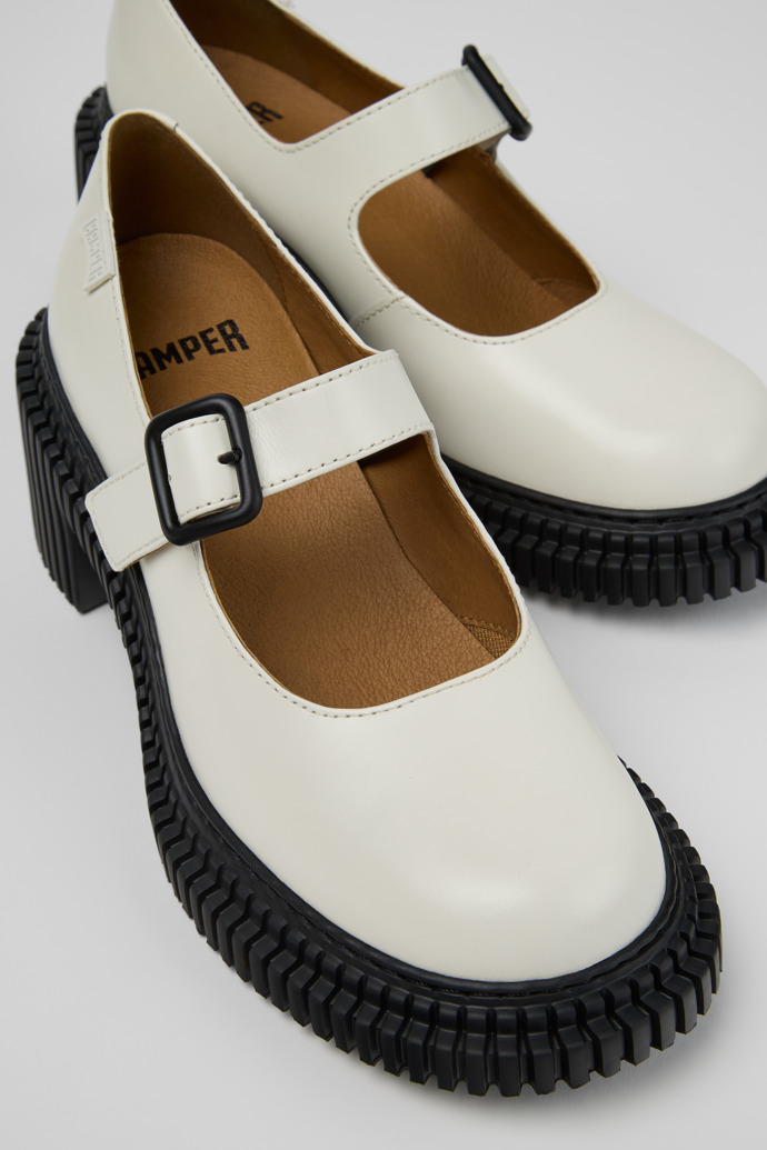 Close-up view of Pix London White Leather Moccasins for Women.