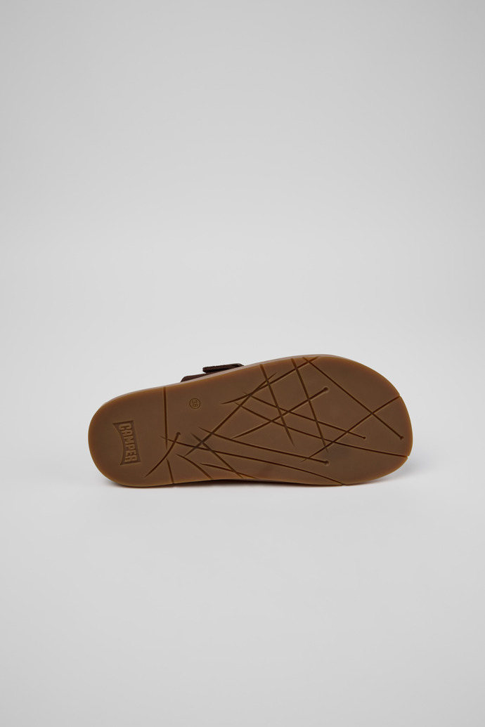 The soles of Lluc Sandal Brown Suede Sandals for Women.