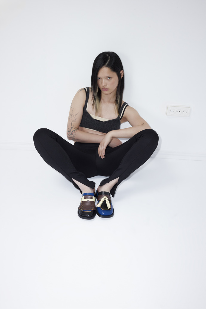 A model wearing Twins Multicolor Leather Moccasins for Women.