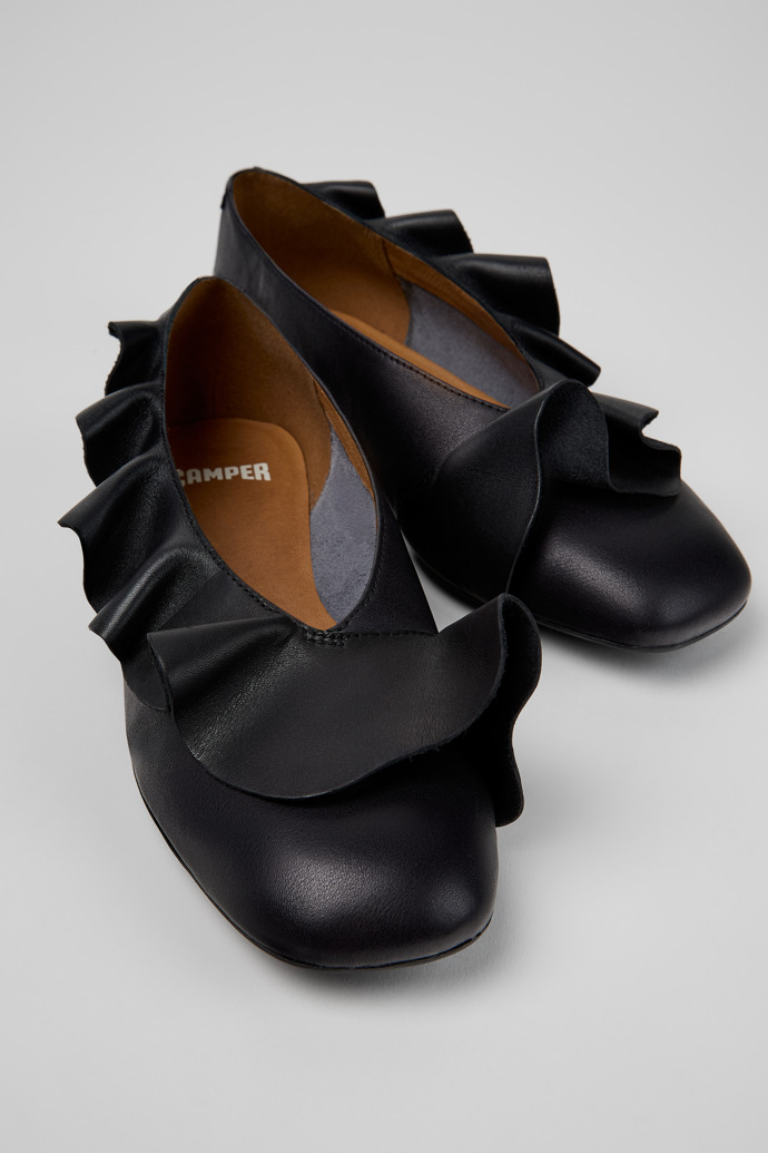 Close-up view of Casi Myra Black Leather Ballerinas for Women.