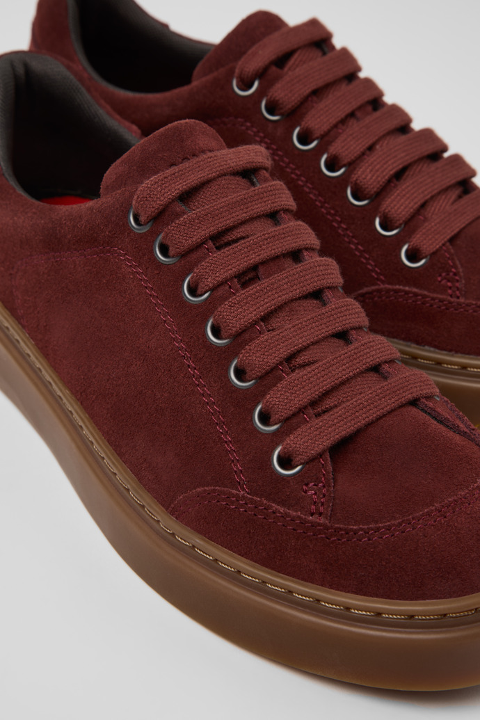 Close-up view of Runner Twentyfive Burgundy Suede Leather Sneakers for Women.