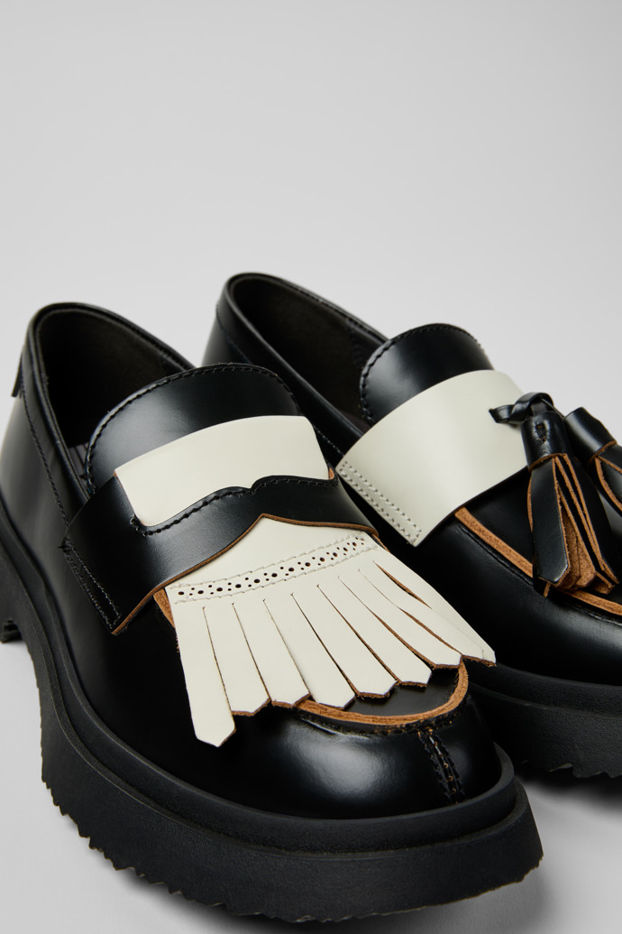 Close-up view of Twins Black Leather Moccasins for Women.