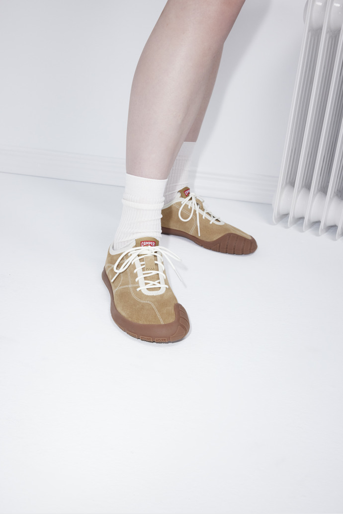 A model wearing Peu Path+ Brown Nubuck Sneakers for Women.