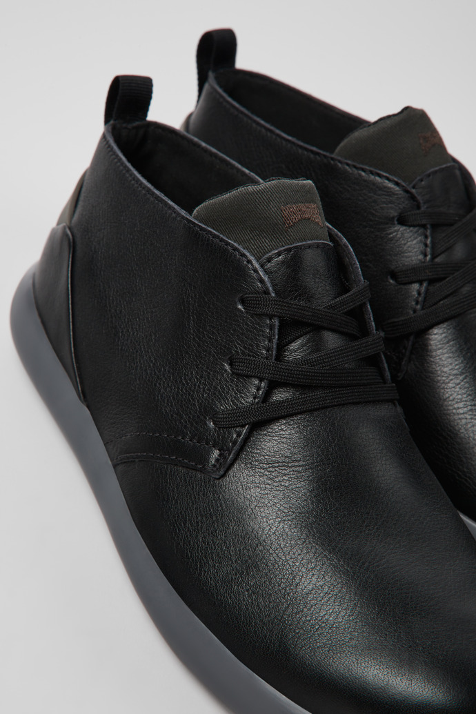 Close-up view of Capsule Black leather and nubuck sneakers for men