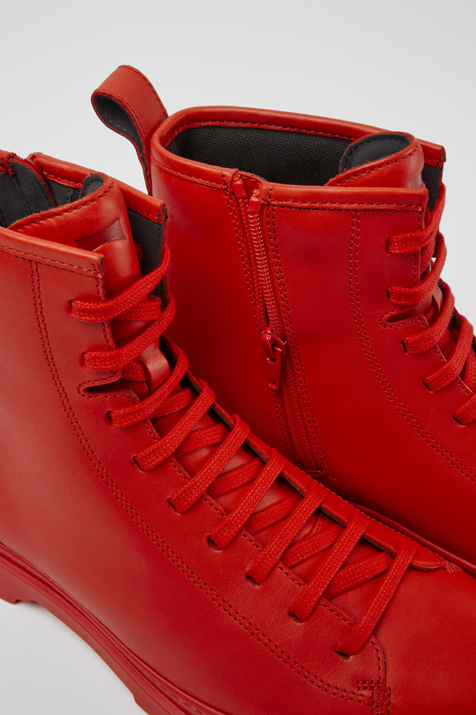 Close-up view of Brutus Red leather lace-up boots