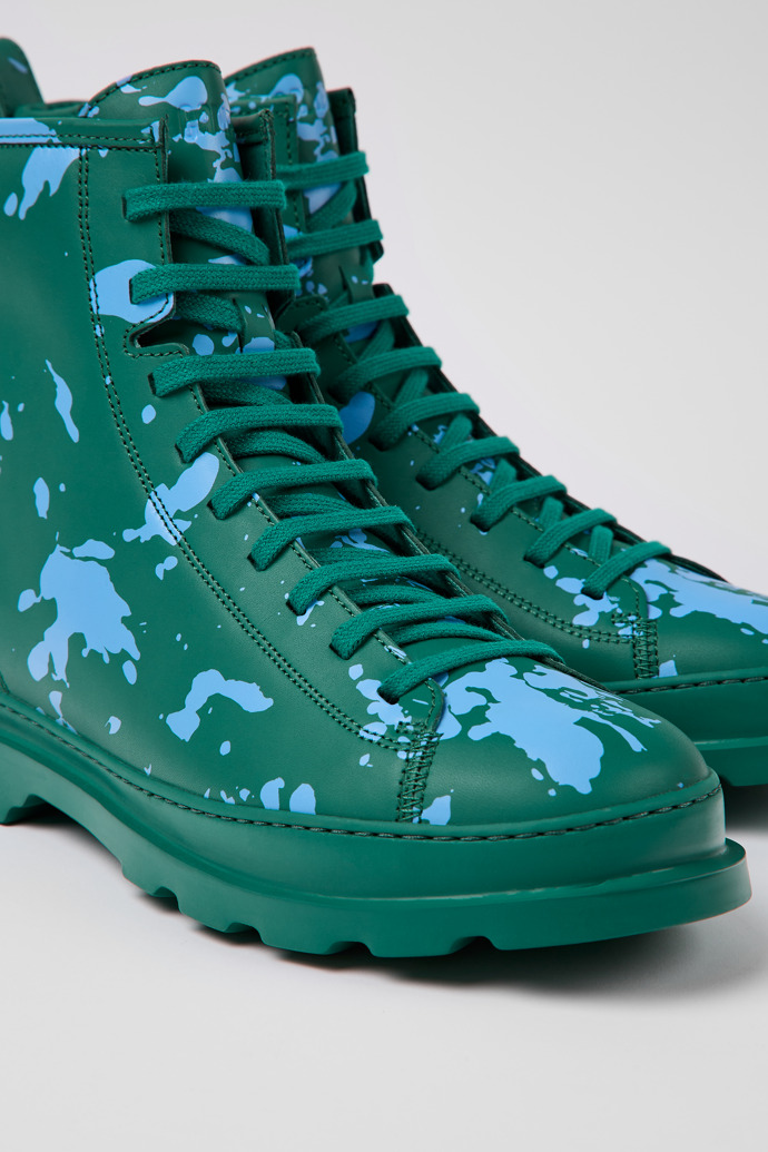 Close-up view of Brutus Green and blue leather ankle boots for men
