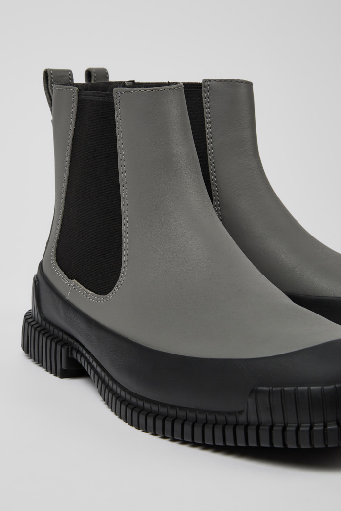 Close-up view of Pix Gray and black leather Chelsea boots for men