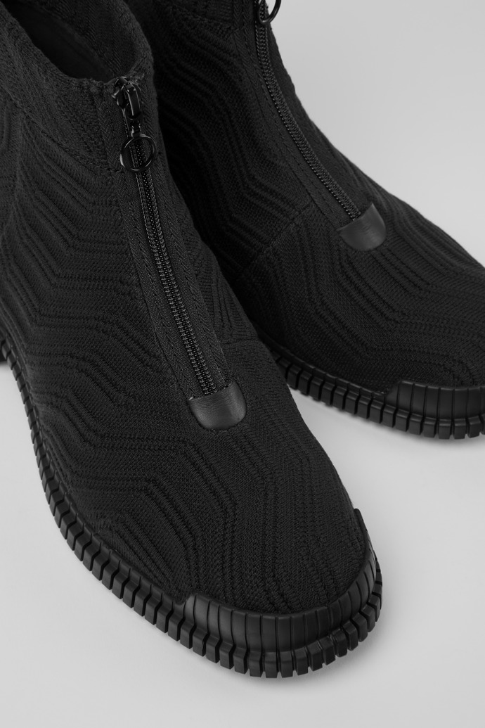 Close-up view of Pix Black zip boots for men