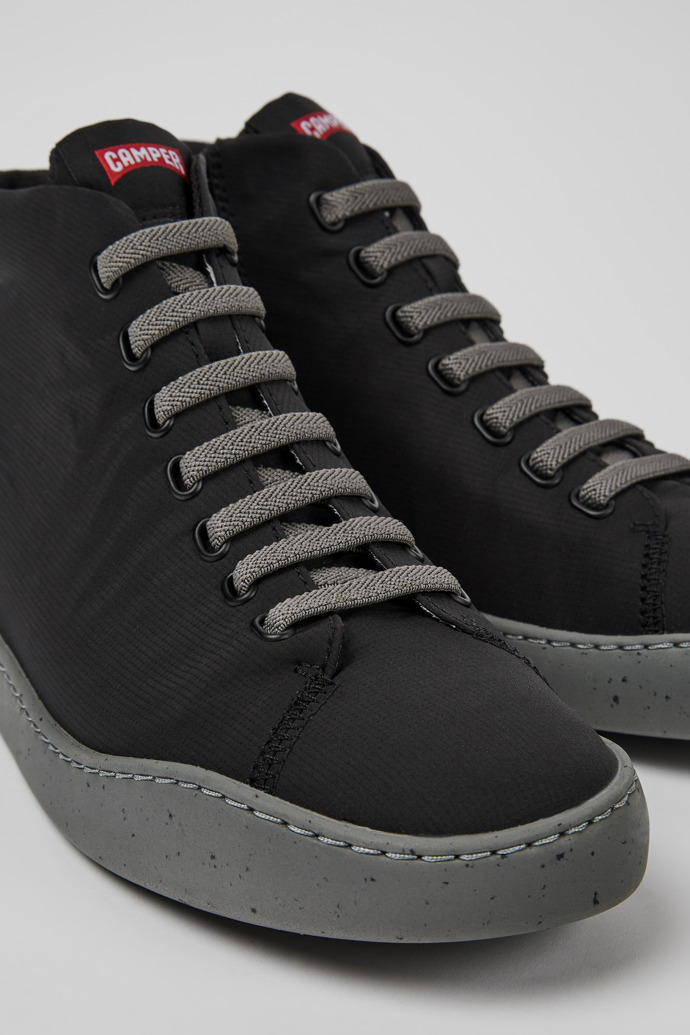 Close-up view of Peu Touring Black recycled PET sneakers for men
