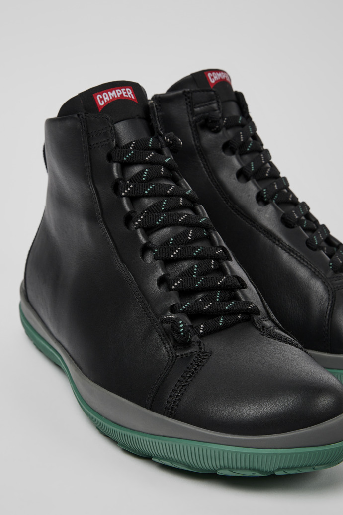 Close-up view of Peu Pista Black leather ankle boots for men