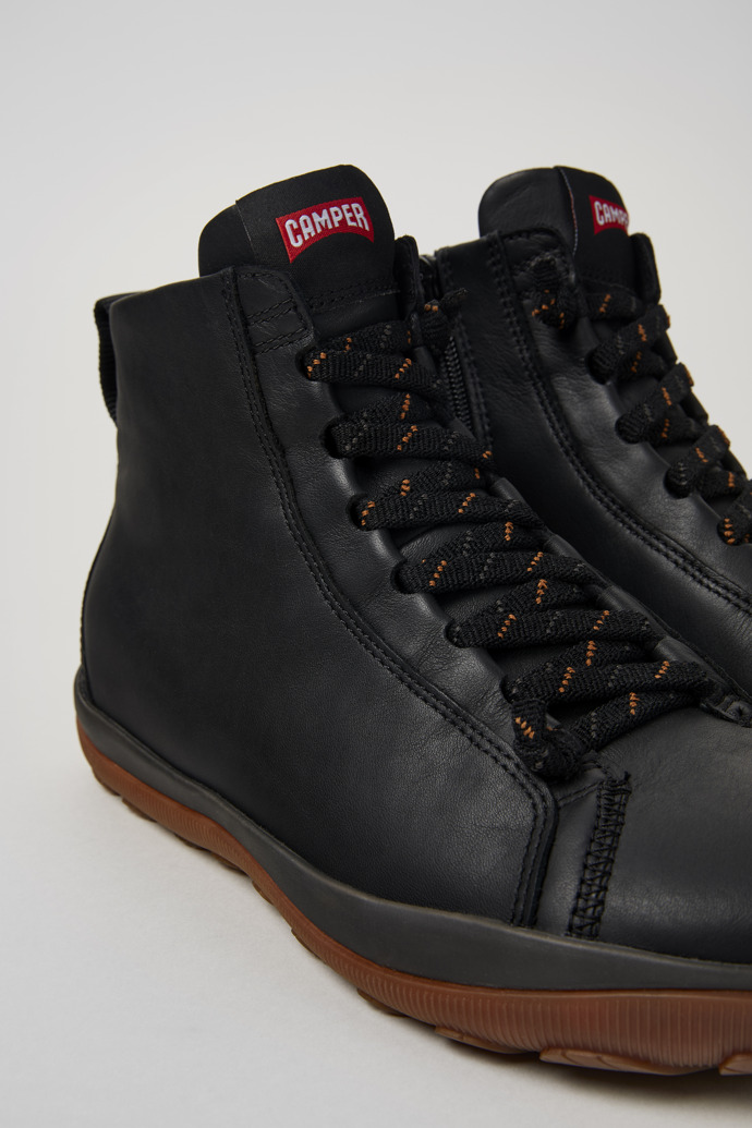 Close-up view of Peu Pista Black leather ankle boots for men