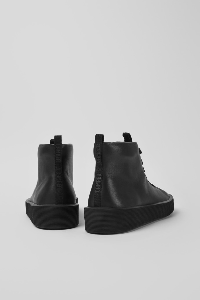 Back view of Courb Black leather ankle boots for men