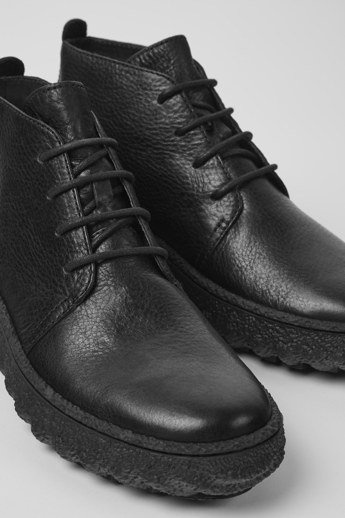 Close-up view of Ground Black lace up ankle boot for men