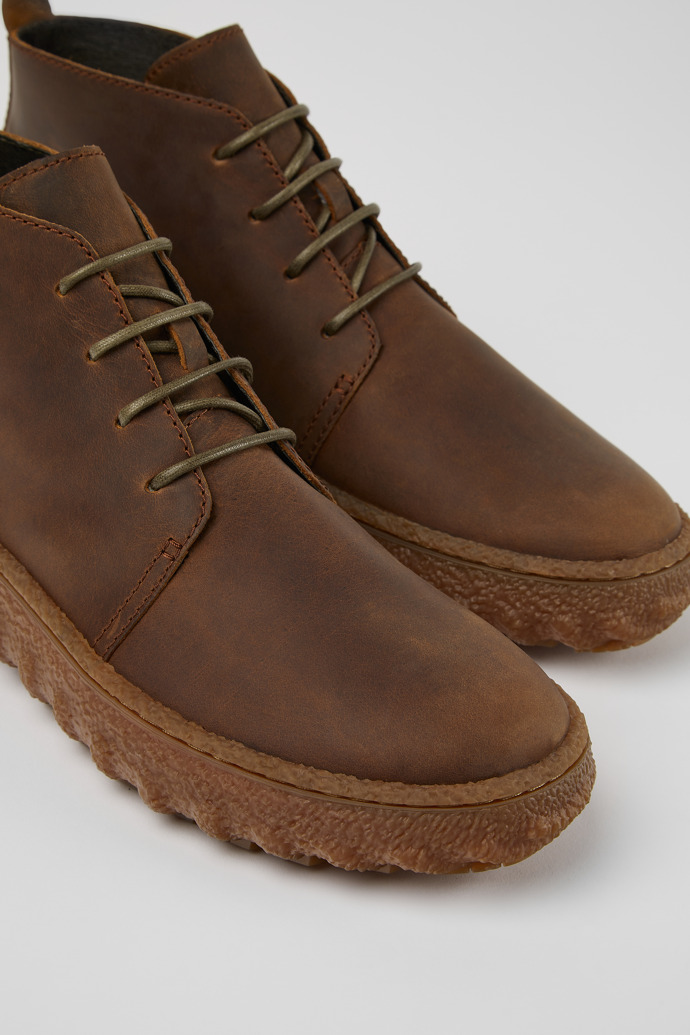 Close-up view of Ground Brown lace up ankle boot for men