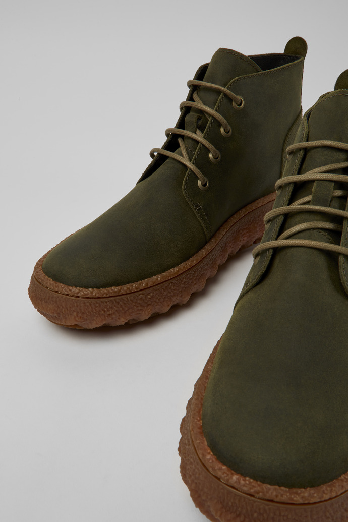 Close-up view of Ground Green waxed suede ankle boots