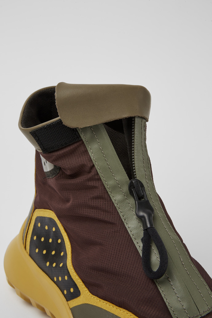 Close-up view of CRCLR Breathable men's brown and yello ankle boots